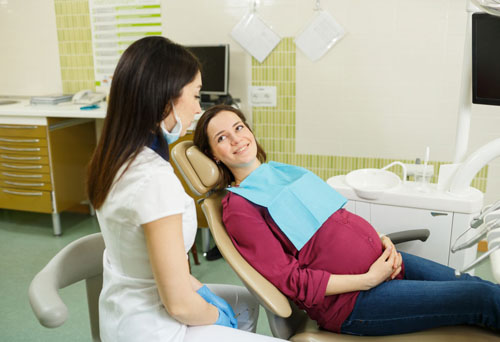 Đau răng khôn khi mang thai nên thăm khám tại nha khoa